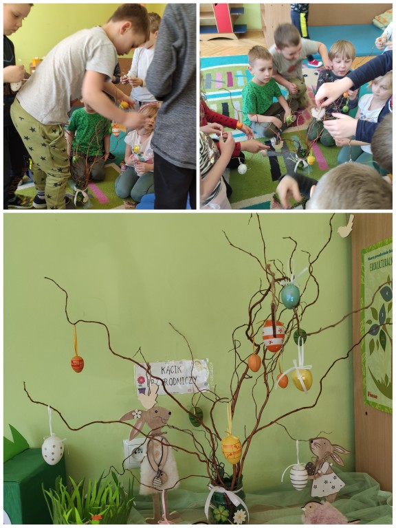 dzieci dekorują drzewko jajkami