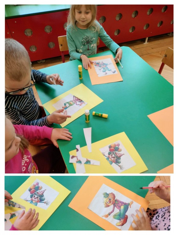 dzieci ukladaja papierowe puzzle